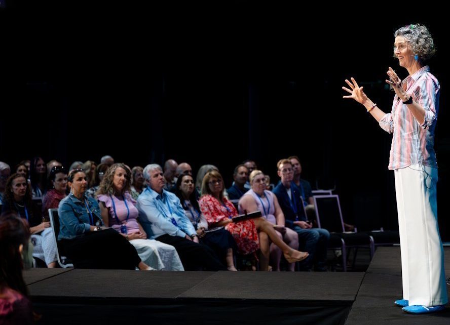 Cristy Burne speaks to a conference from the stage